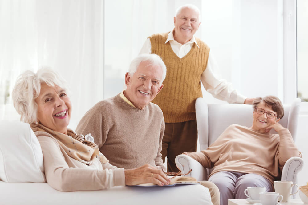 A Group Of Seniors Laugh While Enjoying Senior Living Near Excelsior Springs, Mo.
